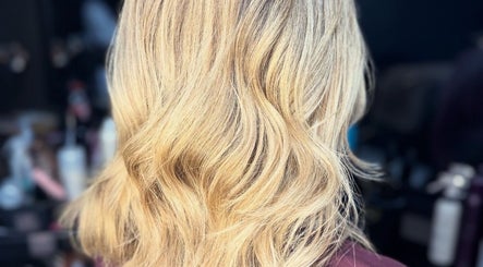 Blonde wavy hairstyle at Retro Rose Hair & Beauty in Guisborough, England, GB, showcasing expert styling.