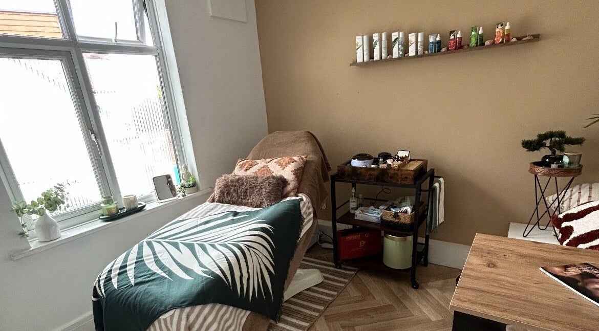 Relaxing treatment room at Remedy Room in West Bridgford, England, GB with cozy decor and natural light.