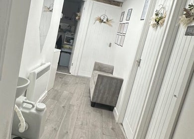 Bright hallway in Skin King & Aesthetics, Leeds, England, GB, featuring elegant decor and modern design.