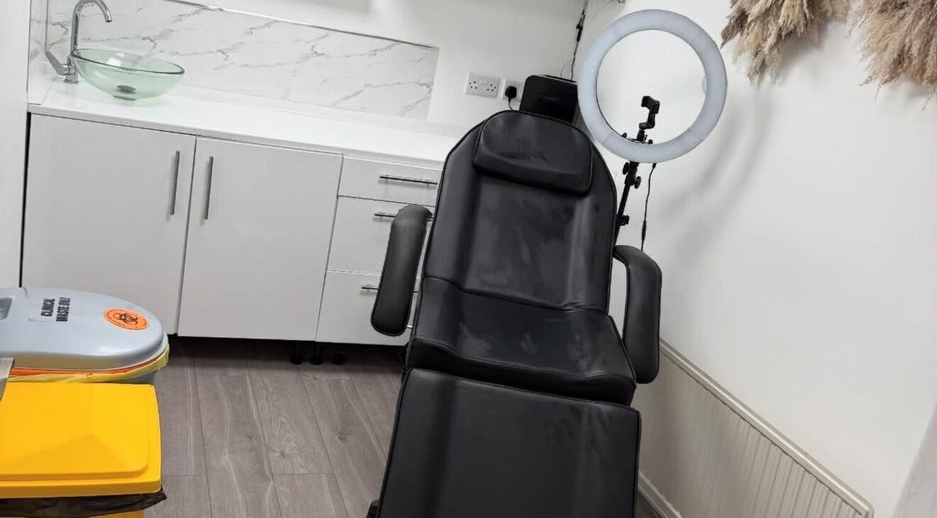 Modern treatment chair at Skin King & Aesthetics, Leeds, England, GB, in a chic, well-equipped room.