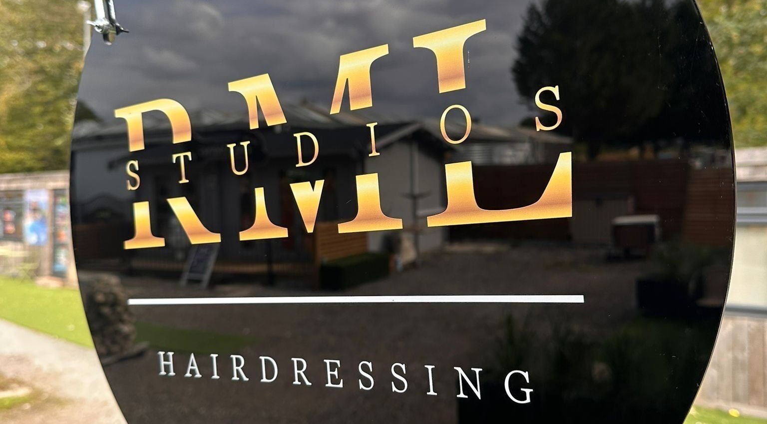 RML Studios hairdressing sign reflects the stylish exterior in Brentwood, England, GB.
