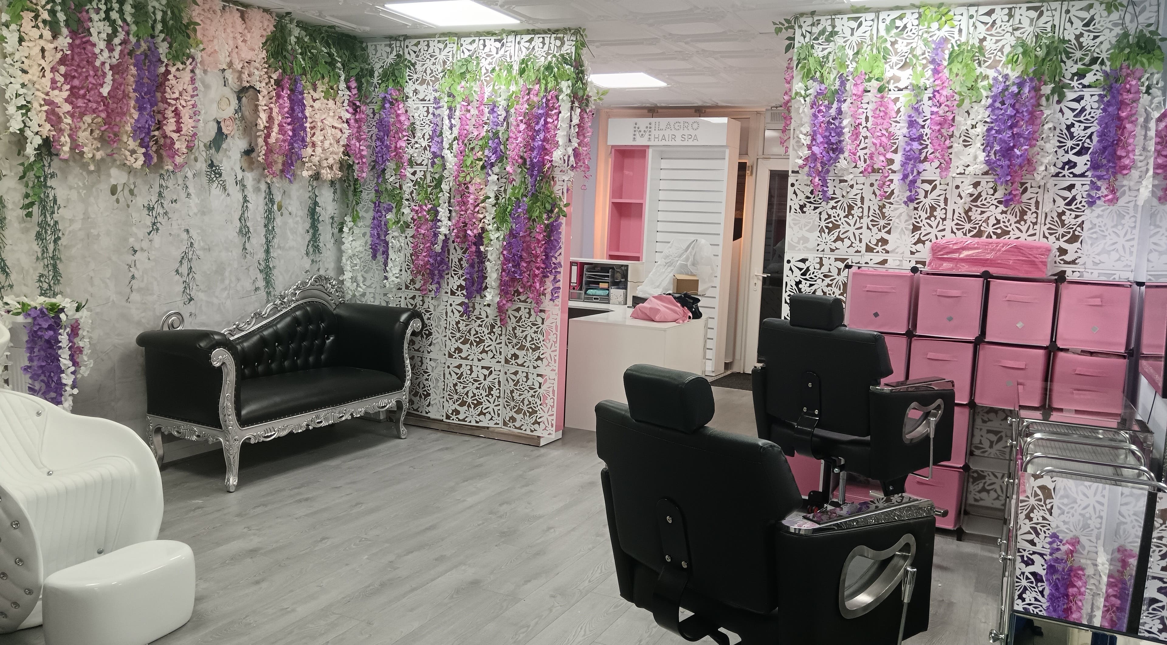 Elegant seating with floral decor at Milagro Hair Spa, Leyland, England, GB. Relax and rejuvenate here.