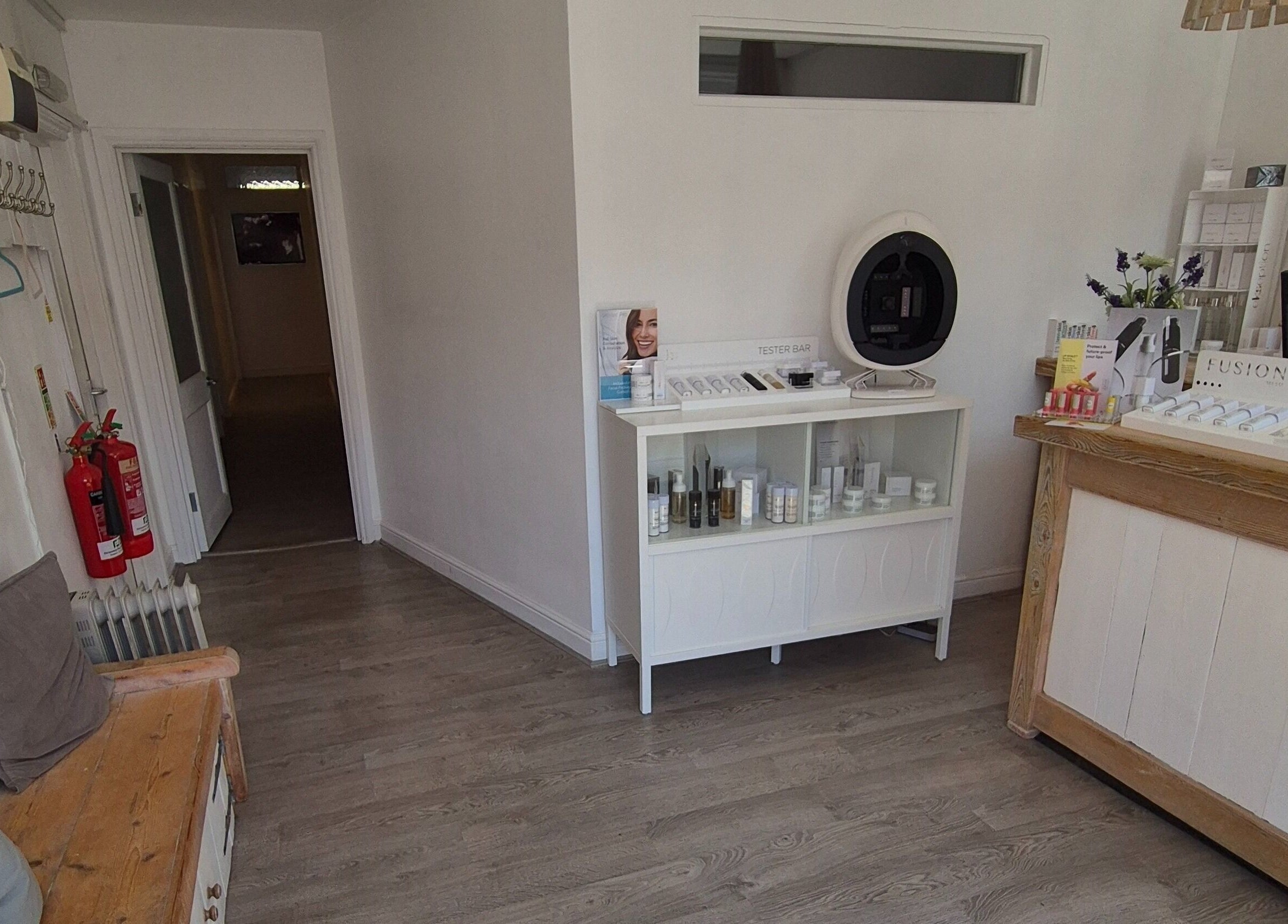 Cozy interior of Gemini Aesthetic in Royal Tunbridge Wells, England, showcasing tester products and natural decor.