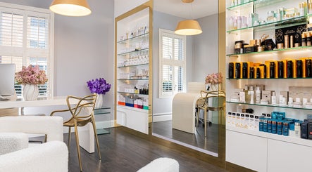 Interior of Skin By Olga, Dublin, County Dublin, IE, showcasing elegant skincare product displays and seating area.