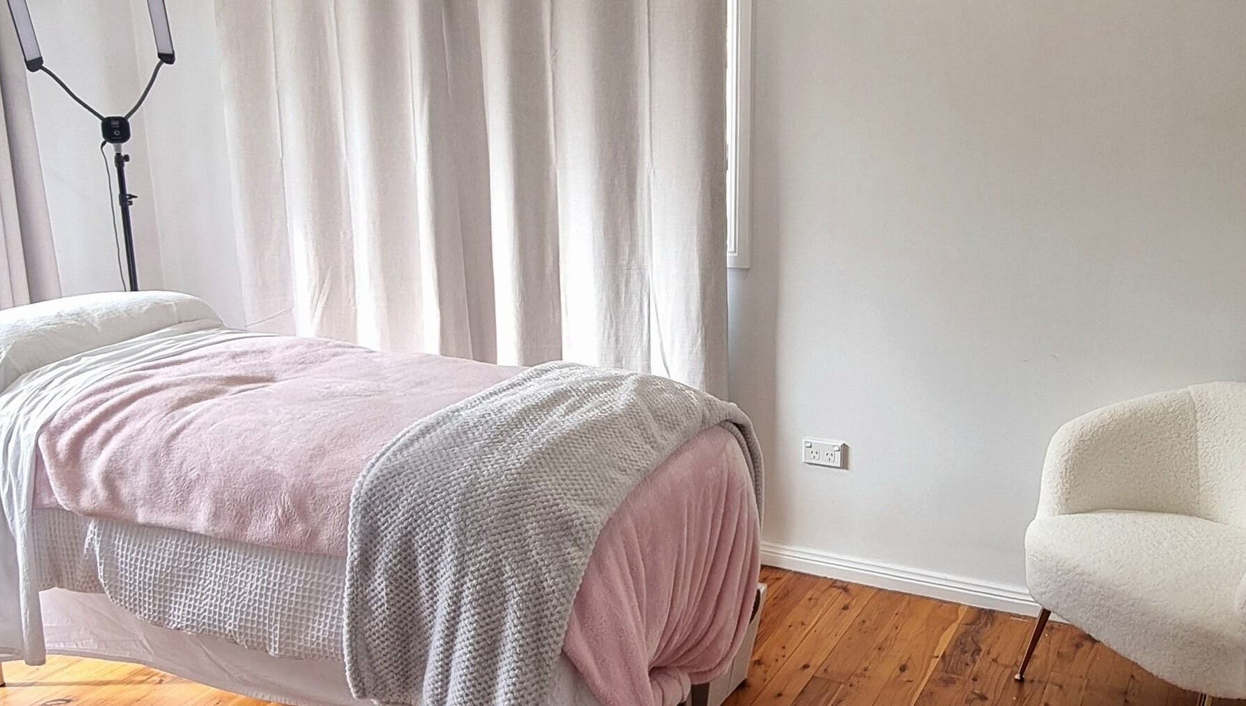 Relaxing treatment room at FlawLiss Beauty, Cooranbong, New South Wales, AU with cozy blankets and tranquil ambiance.