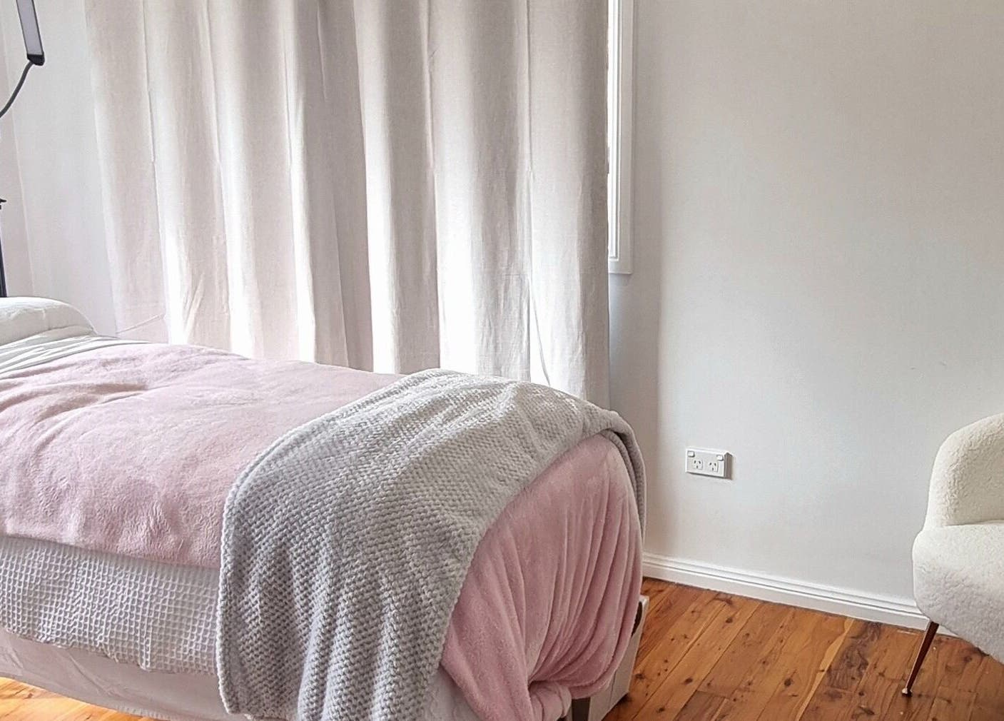 Relaxing treatment room at FlawLiss Beauty, Cooranbong, New South Wales, AU with cozy blankets and tranquil ambiance.