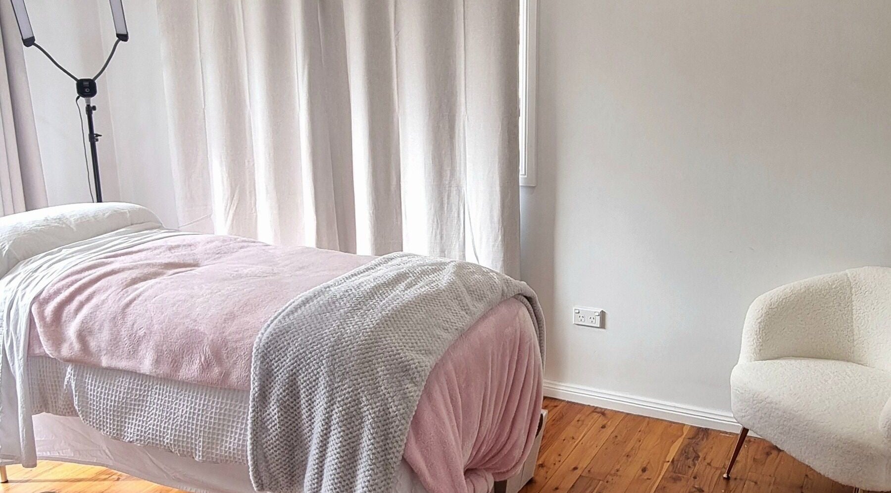 Relaxing treatment room at FlawLiss Beauty, Cooranbong, New South Wales, AU with cozy blankets and tranquil ambiance.