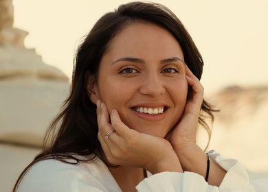Smiling woman enjoying radiant glow at Milla Makhamid | Facialist in Lisboa, Lisboa, PT.