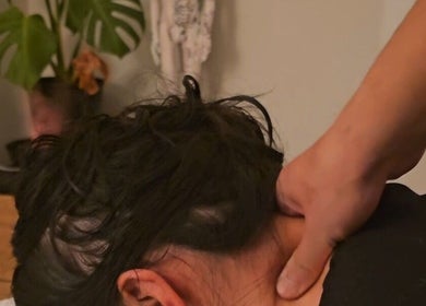 Calming neck massage at Qi Harmony Massage in Normanby, Taranaki, NZ, promoting relaxation and wellness.