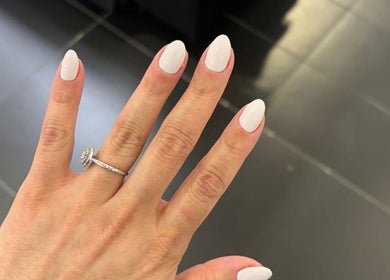 Elegant white manicure at The Nail Bar🍸, Brampton, Ontario, CA, showcasing stylish simplicity.