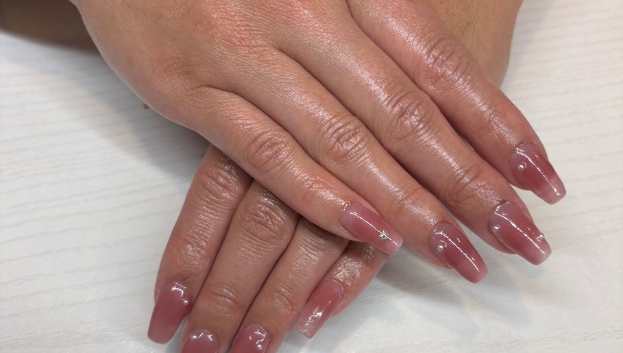 Beautiful manicured nails at The Nail Bar, Brampton, Ontario, CA with a glossy finish and subtle nail art.