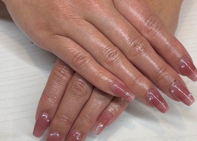 Beautiful manicured nails at The Nail Bar, Brampton, Ontario, CA with a glossy finish and subtle nail art.