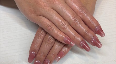 Beautiful manicured nails at The Nail Bar, Brampton, Ontario, CA with a glossy finish and subtle nail art.