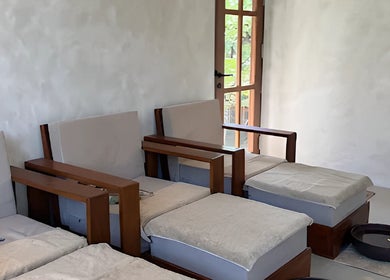 Cozy treatment area at Sol Spa Gili in Nusa Tenggara Barat, ID, featuring plush seating and serene decor.