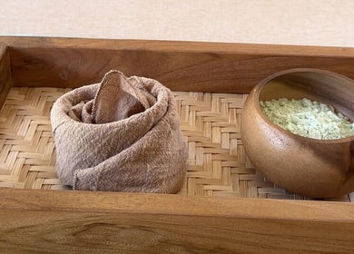 Wooden spa tray with towel and salt at Sol Spa Gili, Nusa Tenggara Barat, ID.