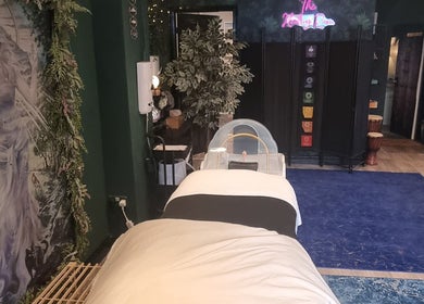 Relaxing therapy room at The Healing Room Oldham, Lees, England, GB, adorned with nature-inspired art.