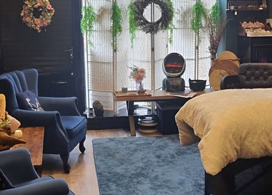 Cozy lounge area at The Healing Room Oldham in Lees, England, GB with plush chairs and ambient decor.