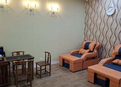 Relaxing lounge area at Angels Wellness Spa, Perth, Western Australia, AU, featuring plush seating and elegant decor.