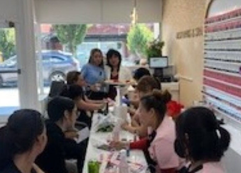 Vibrant interior of Best Nails & Spa, Glenorchy, Tasmania, AU with customers enjoying nail treatments.