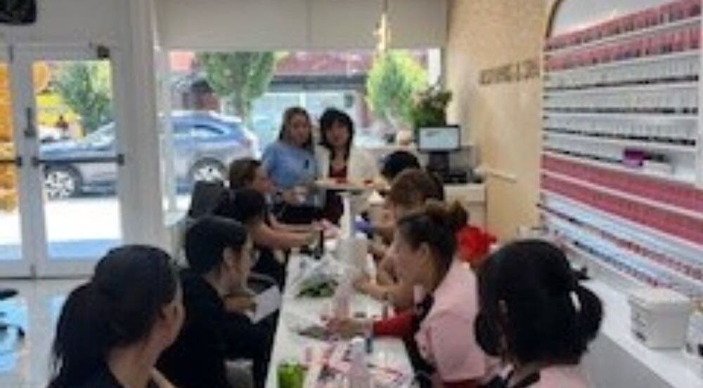 Vibrant interior of Best Nails & Spa, Glenorchy, Tasmania, AU with customers enjoying nail treatments.