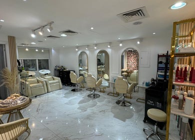 Interior view of Glamsoul Beauty Lounge in Abu Dhabi, showcasing chic salon seating and modern decor.