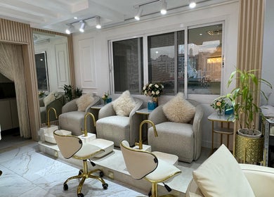 Luxurious pedicure area at Glamsoul Beauty Lounge in Abu Dhabi, AE, with plush chairs and decorative elements.