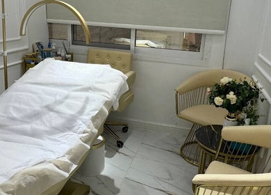 Luxurious treatment room at Glamsoul Beauty Lounge, Abu Dhabi, AE with elegant decor and comfortable seating.