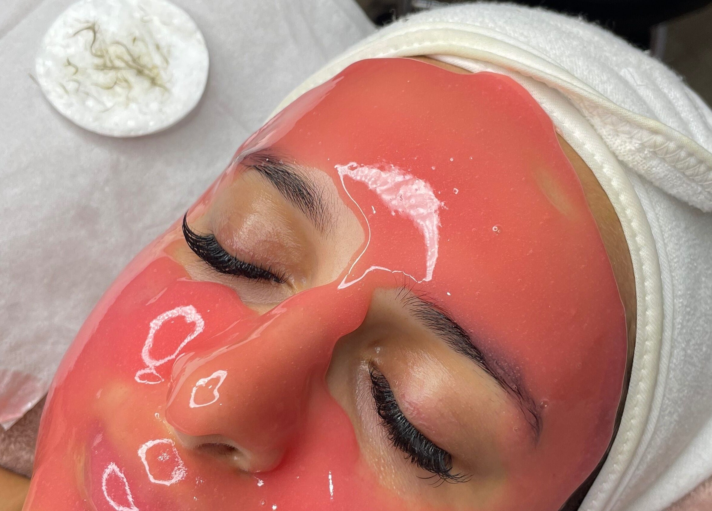 Woman enjoying a rejuvenating facial at Naked Skin Space in Glenmore Park, New South Wales, AU.