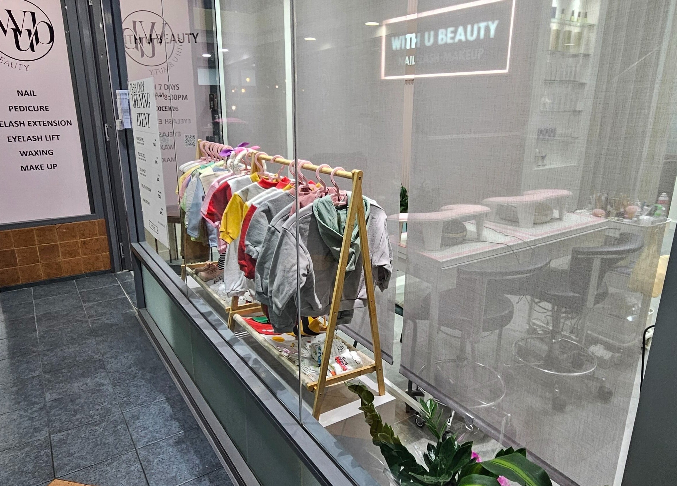 WithUBeauty storefront in Strathfield, New South Wales, AU showcasing colorful apparel and beauty services.