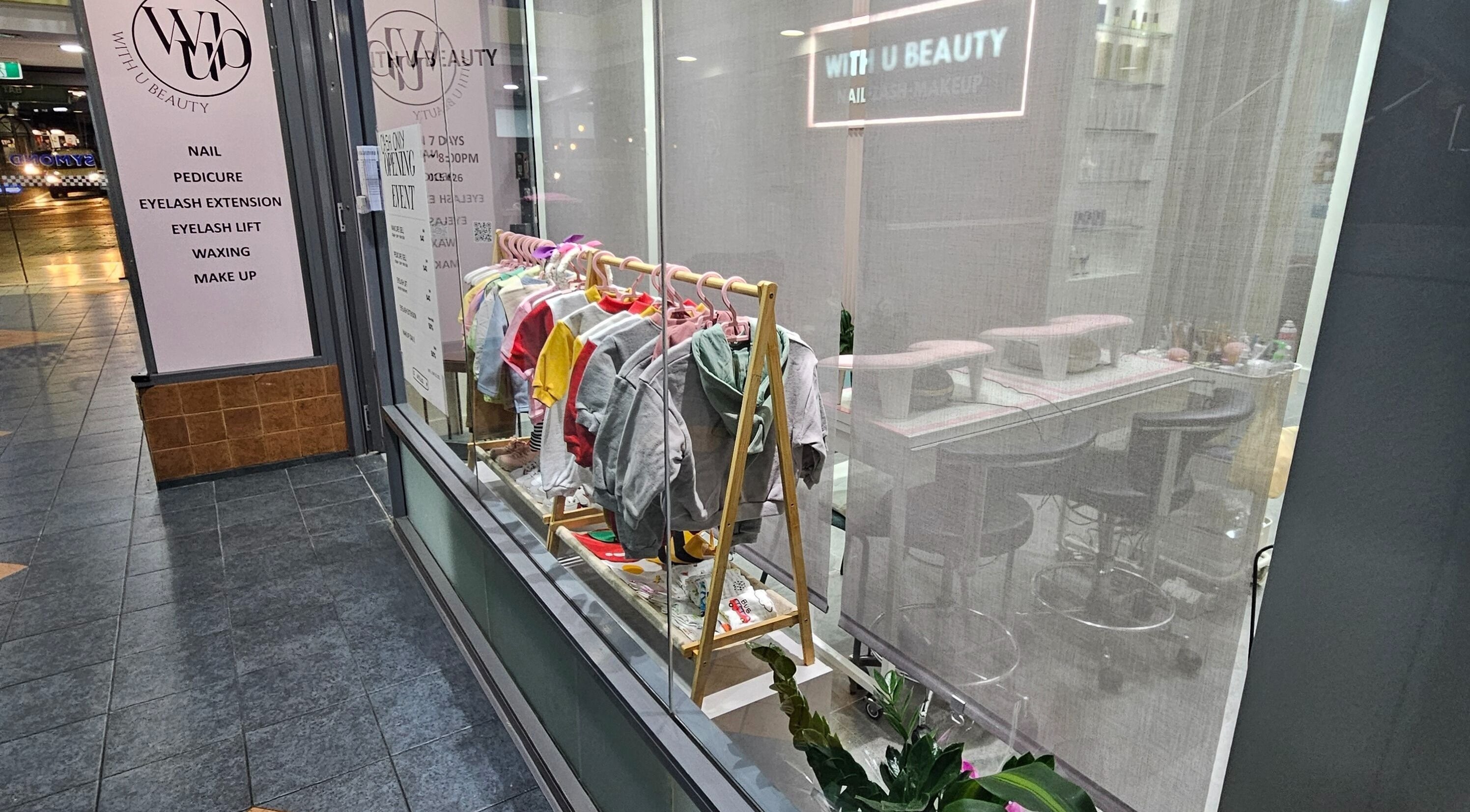WithUBeauty storefront in Strathfield, New South Wales, AU showcasing colorful apparel and beauty services.