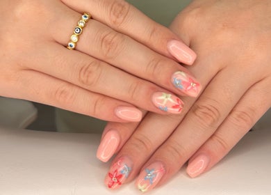 Artful floral nail design at Polished By Em in Polesworth, England, GB.