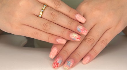 Artful floral nail design at Polished By Em in Polesworth, England, GB.