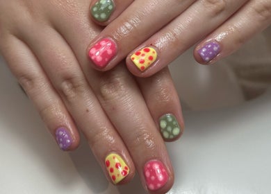 Vibrant polka dot nail art at Polished By Em, Polesworth, England, GB. A stunning display of creativity and skill.
