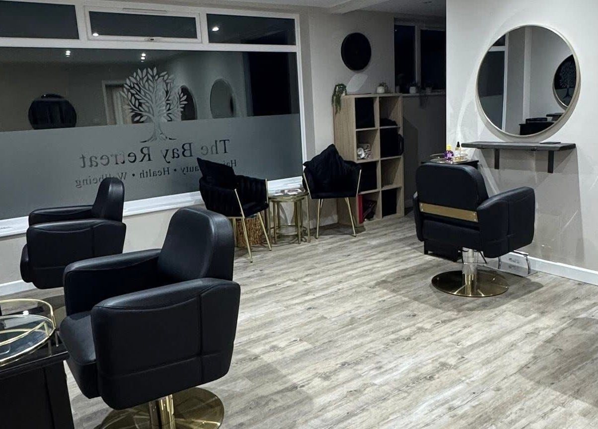 Chic interior of Megan's Beauty, Norwich, England, GB with stylish salon chairs and mirrors.