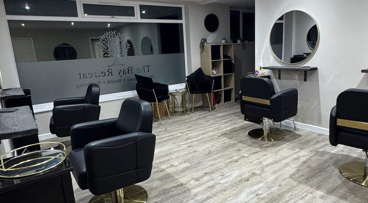 Chic interior of Megan's Beauty, Norwich, England, GB with stylish salon chairs and mirrors.