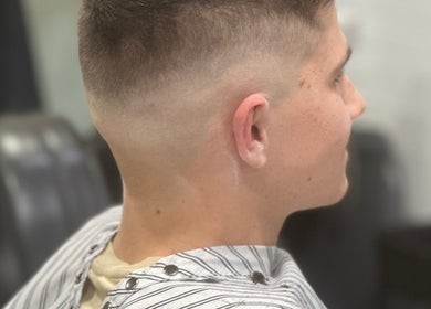 Side profile of a man with a fresh fade haircut at Style Lounge Hairdressing and Barbering, Melbourne, Victoria, AU.