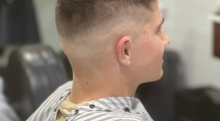 Side profile of a man with a fresh fade haircut at Style Lounge Hairdressing and Barbering, Melbourne, Victoria, AU.