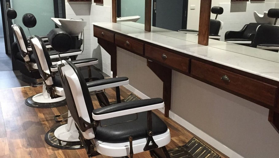Barber chairs at Style Lounge Hairdressing and Barbering, Melbourne, Victoria, AU with a sleek, modern design.