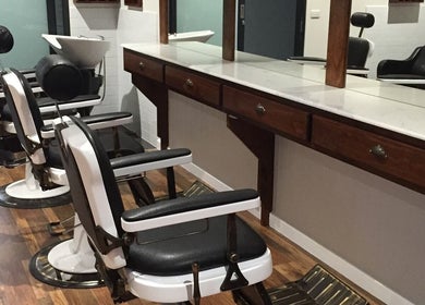 Barber chairs at Style Lounge Hairdressing and Barbering, Melbourne, Victoria, AU with a sleek, modern design.