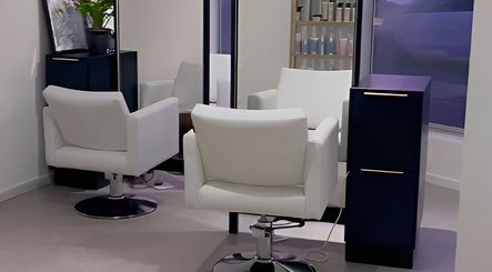 Elegant salon chairs and mirrors at Alchemy Hair & Beauty, Cape Town, Western Cape, ZA.