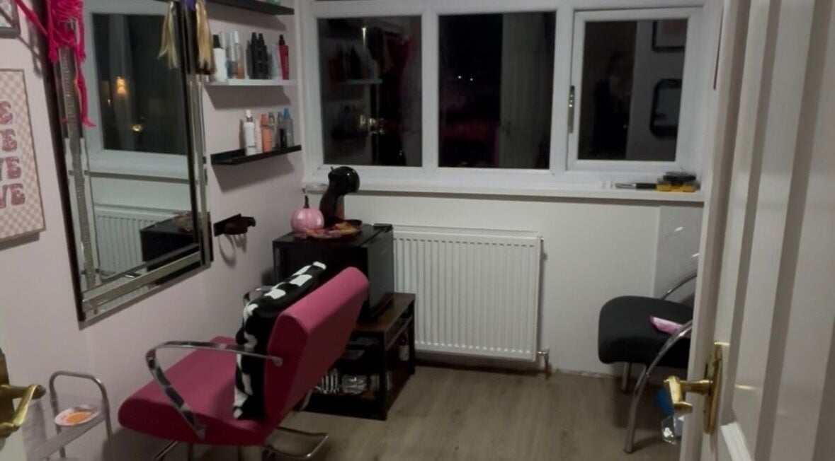 Cozy salon area at Zoe Lottie - Hair in Shinfield, England, GB, featuring stylish decor and a pink salon chair.