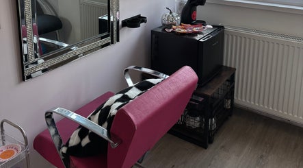 Elegant salon chair and mirror at Zoe Lottie - Hair, Shinfield, England, GB, showcasing a stylish beauty setup.