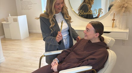 Client enjoys a beauty session at N Dbrows&Beauty, Busby, Scotland, GB. The cozy interior enhances the experience.
