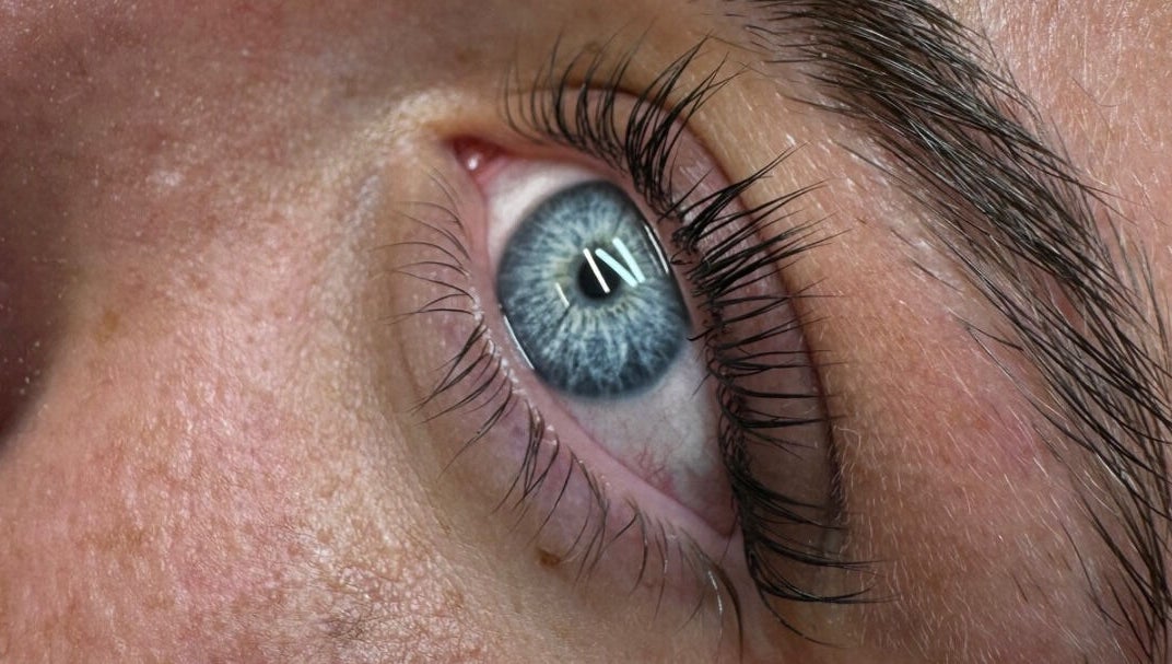 Close-up of eyelash extension at Lash By GH in Whitwell, England, GB showcasing blue eye with enhanced lashes.
