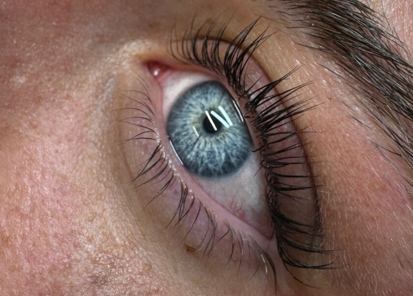 Close-up of eyelash extension at Lash By GH in Whitwell, England, GB showcasing blue eye with enhanced lashes.