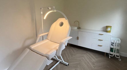 Luxurious treatment room at Neutral Grounds, Portchester, England, GB with a modern reclining chair and sleek decor.