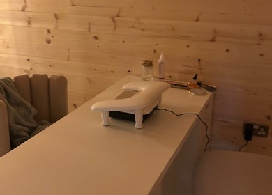 Manicure station at By Madison Olivia, Kirk Sandall, England, GB, with cozy chair and wooden walls.