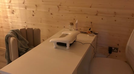 Manicure station at By Madison Olivia, Kirk Sandall, England, GB, with cozy chair and wooden walls.