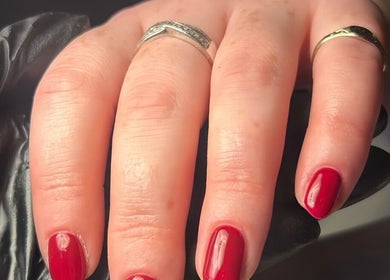 Elegant red manicure by By Madison Olivia in Kirk Sandall, England, GB. Stunning nail artistry.