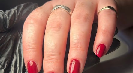 Elegant red manicure by By Madison Olivia in Kirk Sandall, England, GB. Stunning nail artistry.